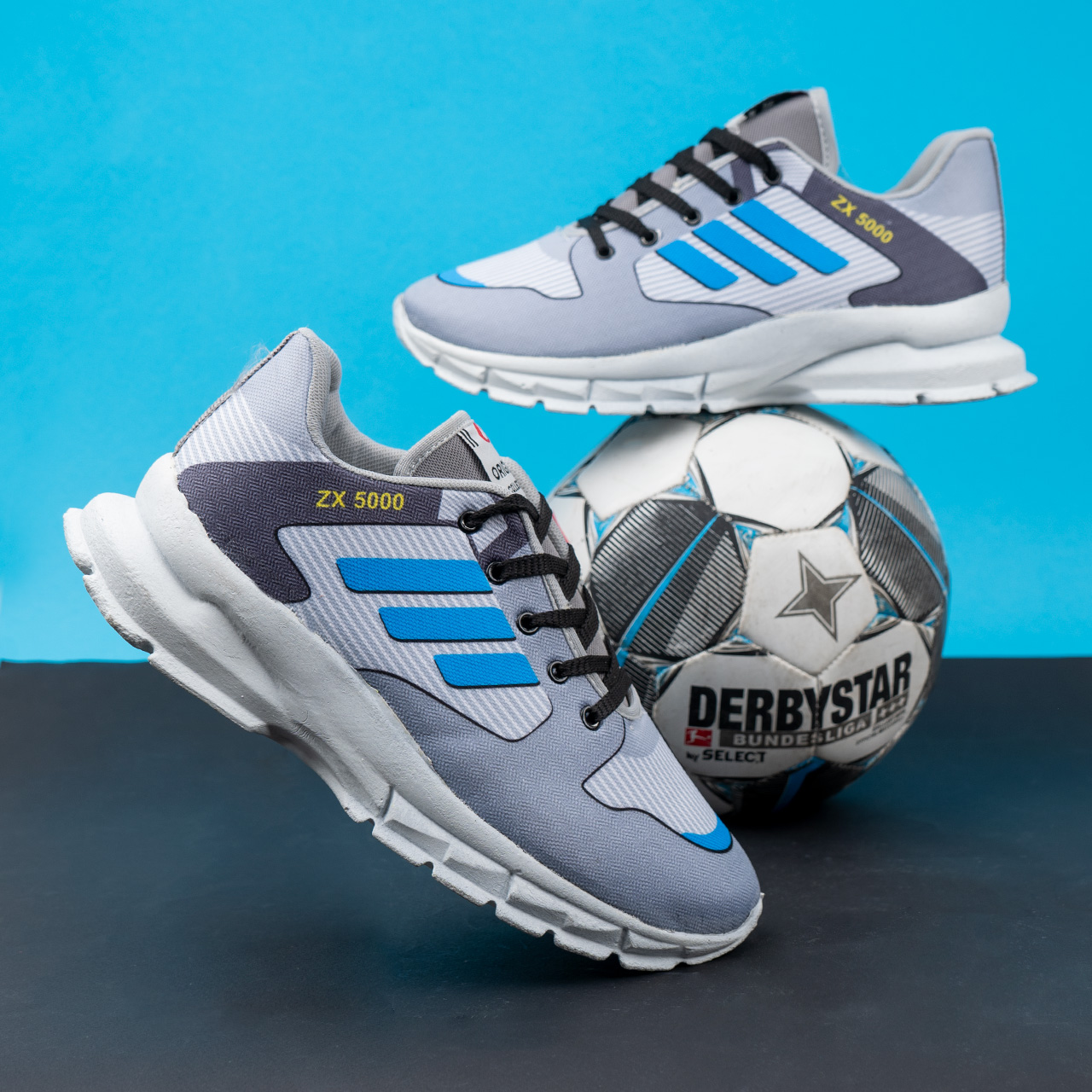 کفش ورزشی مردانه طوسی سه خط آبی مدل ZX5000